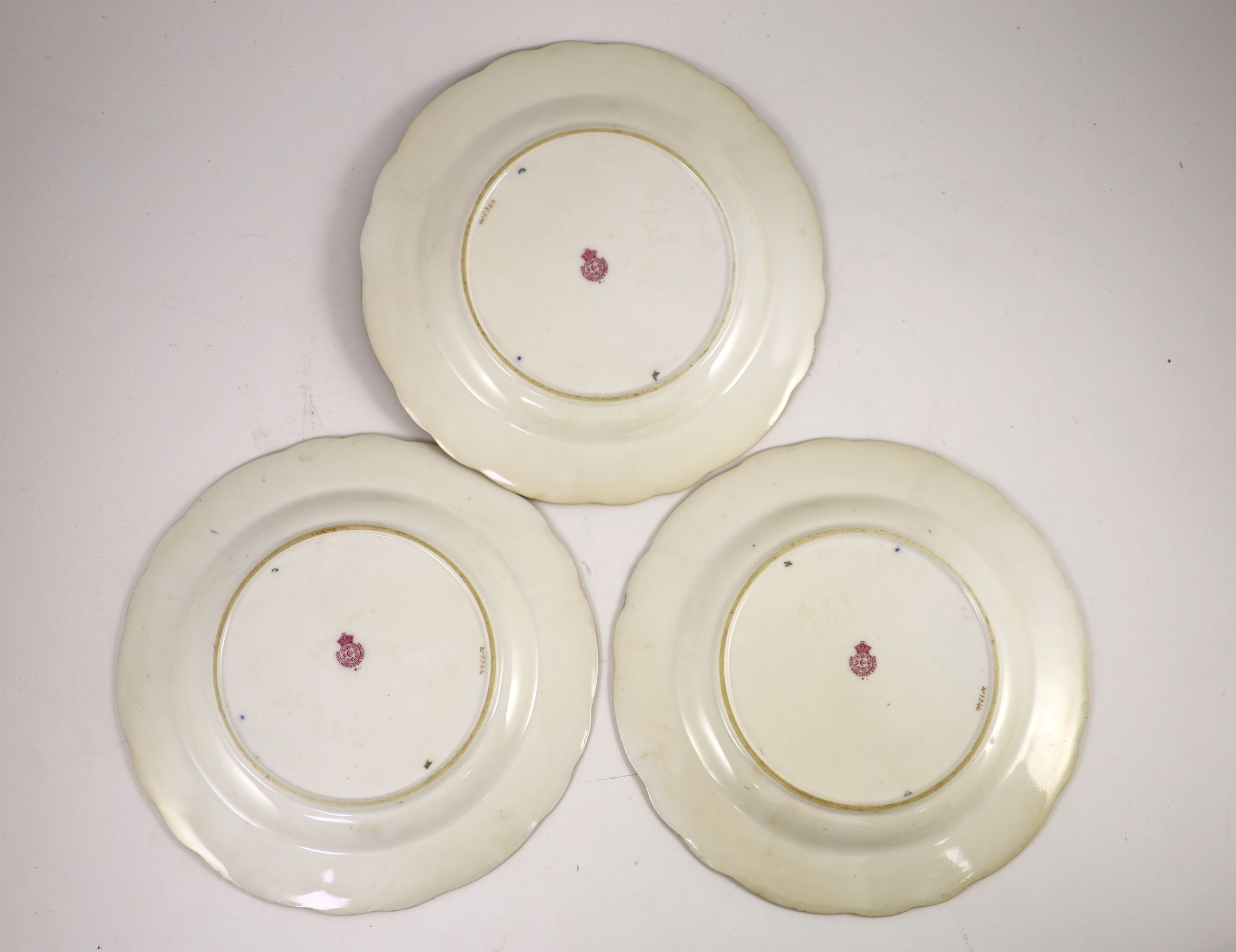 Three Royal Worcester fruit painted dessert plates, signed E. Phillips, c.1918, 22.5cm diameter